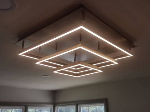 Large square ceiling light fixture installation by Sloan Electric, LLC
